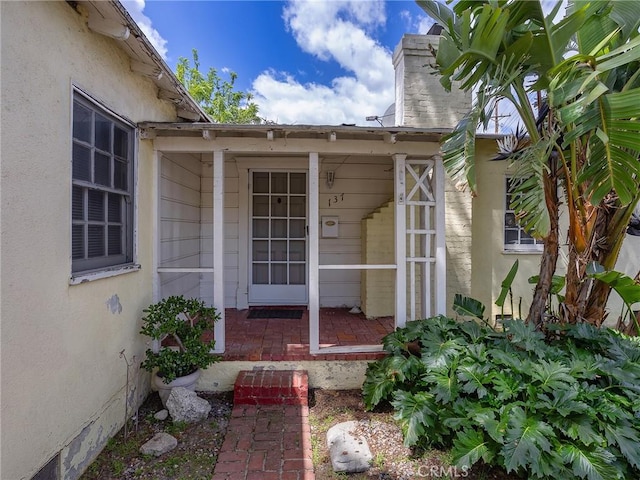 137 N Rose St, Burbank, CA 91505 - entrance to property with a chimney, stucco siding, and a porch