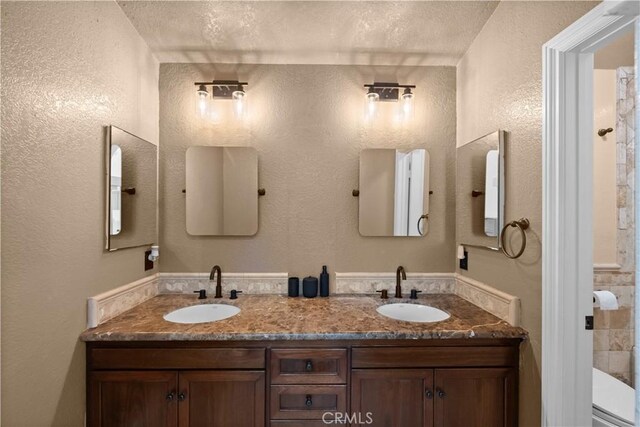 15 Vittoria St, Laguna Niguel, CA 92677 - bathroom with double vanity and a textured wall
