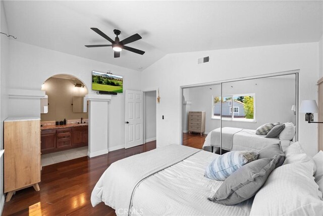 15 Vittoria St, Laguna Niguel, CA 92677 - bedroom featuring lofted ceiling, arched walkways, wood finished floors, a sink, and a closet