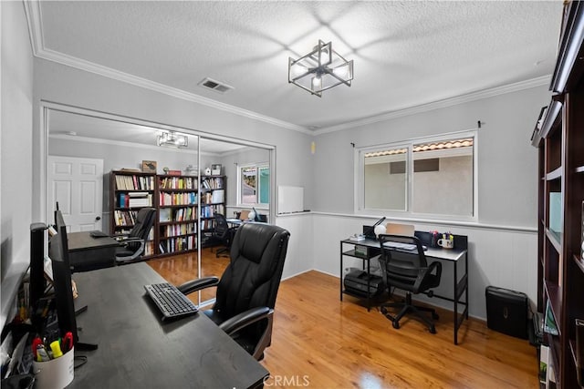 15 Vittoria St, Laguna Niguel, CA 92677 - home office with light wood-type flooring, a textured ceiling, ornamental molding, and a wainscoted wall