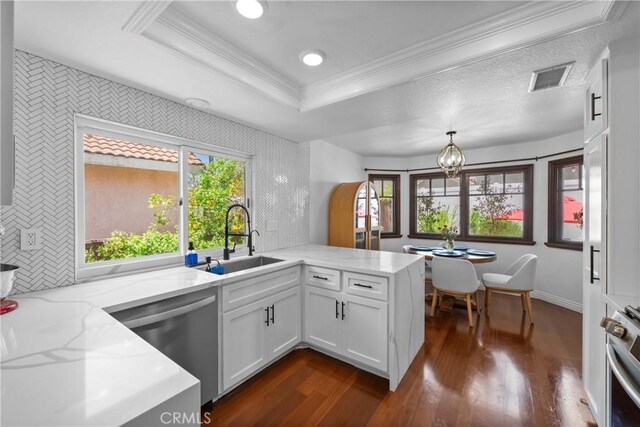 15 Vittoria St, Laguna Niguel, CA 92677 - kitchen featuring a sink, dishwasher, a peninsula, range, and dark wood-style flooring