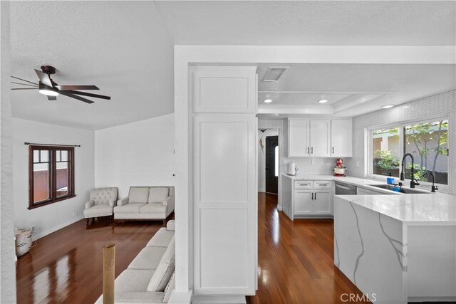 15 Vittoria St, Laguna Niguel, CA 92677 - kitchen featuring a sink, dark wood finished floors, white cabinets, stainless steel dishwasher, and recessed lighting