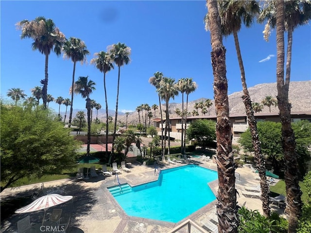 470 S Calle Encilia Unit B11, Palm Springs, CA 92262 - community pool featuring a mountain view and a patio area