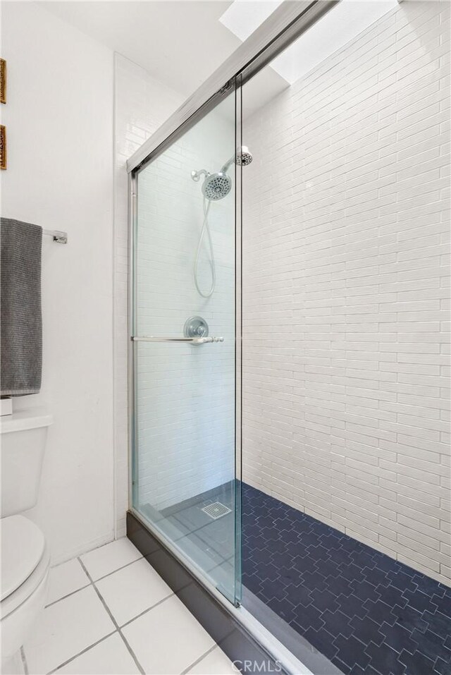 23622 Wakefield Ct Unit 69, Laguna Niguel, CA 92677 - bathroom featuring tile patterned floors, a shower stall, and toilet