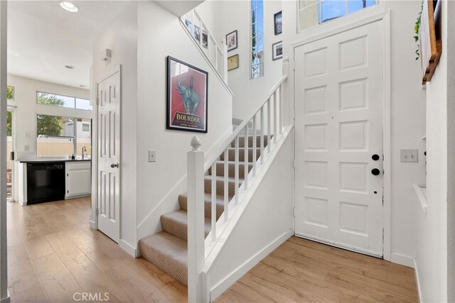 23622 Wakefield Ct Unit 69, Laguna Niguel, CA 92677 - entrance foyer featuring light wood-type flooring, stairs, baseboards, and recessed lighting