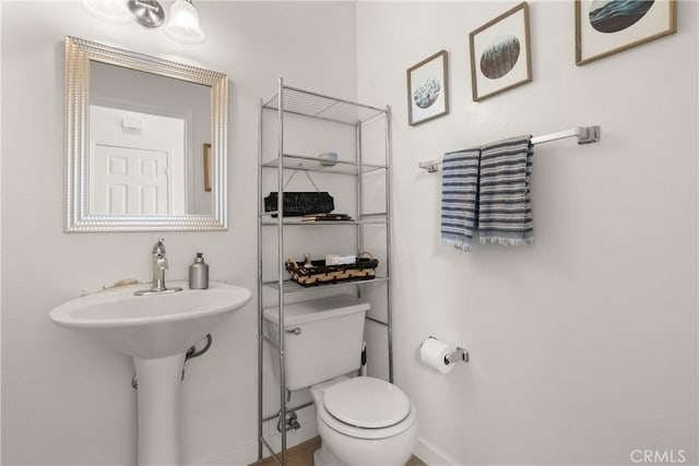 23622 Wakefield Ct Unit 69, Laguna Niguel, CA 92677 - bathroom featuring toilet, baseboards, and a sink