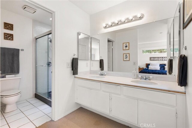 23622 Wakefield Ct Unit 69, Laguna Niguel, CA 92677 - ensuite bathroom with toilet, a stall shower, double vanity, and tile patterned flooring