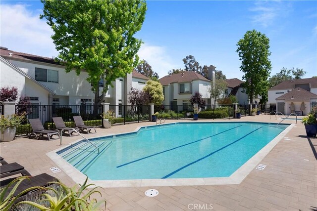 23622 Wakefield Ct Unit 69, Laguna Niguel, CA 92677 - community pool featuring fence, a residential view, and a patio area