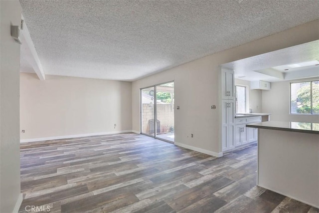 845 Daffodil Dr, Riverside, CA 92507 - unfurnished room with wood finished floors, a textured ceiling, and baseboards