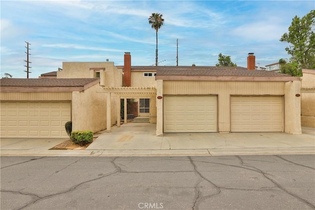 845 Daffodil Dr, Riverside, CA 92507 - view of front of property with a chimney, stucco siding, and roof with shingles