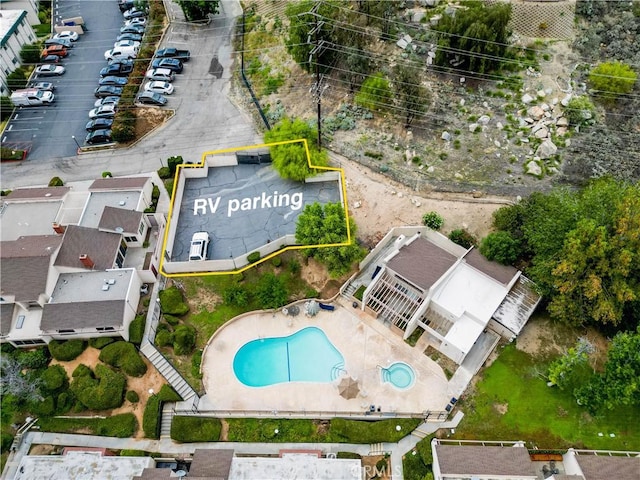 845 Daffodil Dr, Riverside, CA 92507 - aerial view of property and surrounding area featuring a pool area and property parcel outlined