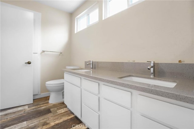845 Daffodil Dr, Riverside, CA 92507 - full bath with double vanity, toilet, and wood finished floors