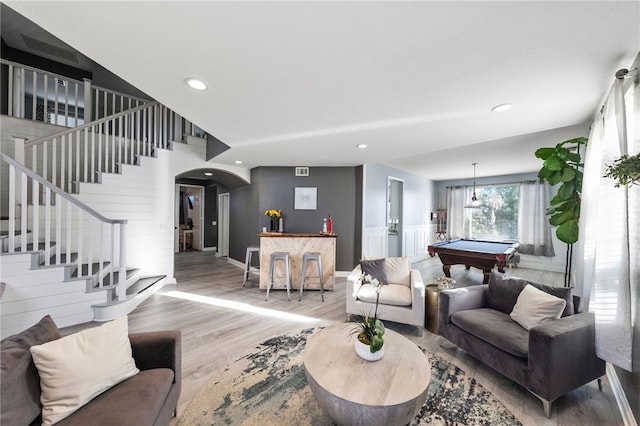 32871 Levi Ct, Temecula, CA 92592 - living room featuring billiards table, arched walkways, wood finished floors, stairs, and recessed lighting