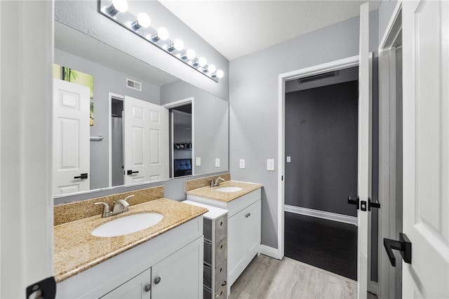 32871 Levi Ct, Temecula, CA 92592 - bathroom with two vanities and wood finished floors