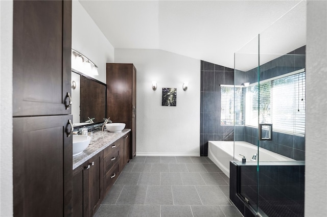 32871 Levi Ct, Temecula, CA 92592 - full bath with vaulted ceiling, a bath, double vanity, tile patterned floors, and an enclosed shower