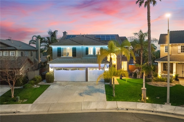 32871 Levi Ct, Temecula, CA 92592 - traditional home featuring an attached garage, a tile roof, a front yard, driveway, and solar panels