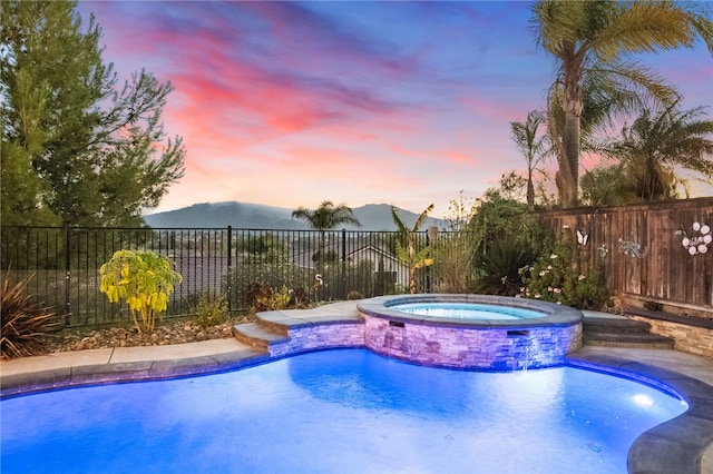 32871 Levi Ct, Temecula, CA 92592 - view of swimming pool featuring a mountain view and a pool with connected hot tub