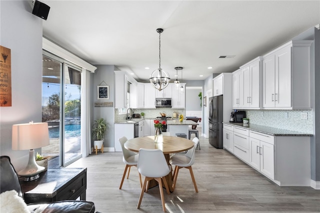 32871 Levi Ct, Temecula, CA 92592 - dining room featuring recessed lighting, a chandelier, and light wood finished floors