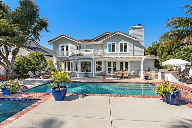 8 Capri, Laguna Niguel, CA 92677 - rear view of property featuring a balcony, an outdoor kitchen, french doors, and a patio area