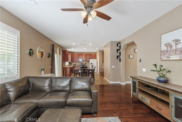 1709 Duncan Way, Corona, CA 92881 - living area with dark wood finished floors, a ceiling fan, recessed lighting, arched walkways, and baseboards