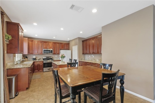1709 Duncan Way, Corona, CA 92881 - dining room featuring light tile patterned floors, recessed lighting, and baseboards