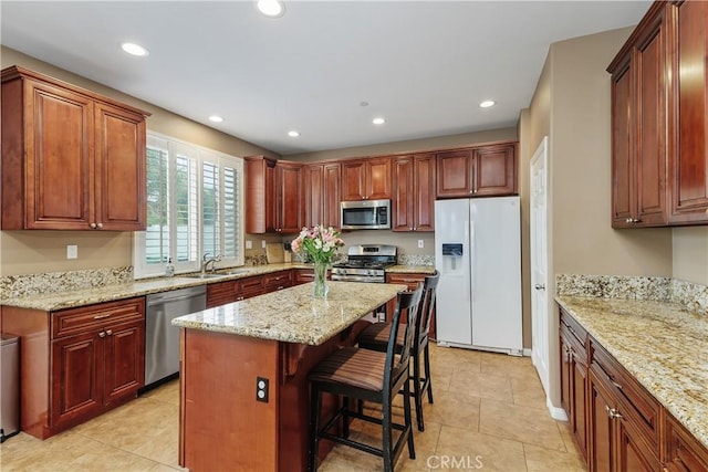 1709 Duncan Way, Corona, CA 92881 - kitchen with appliances with stainless steel finishes, a sink, recessed lighting, a kitchen bar, and light tile patterned floors