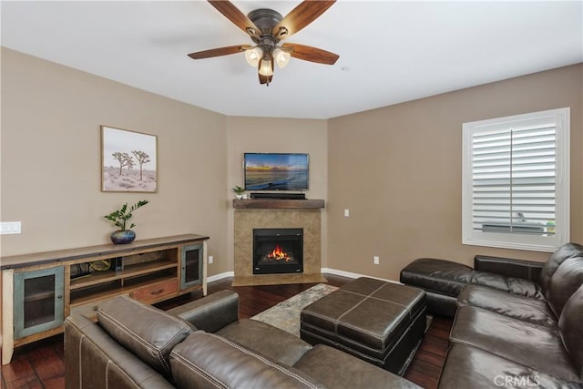 1709 Duncan Way, Corona, CA 92881 - living room with dark wood finished floors, ceiling fan, a fireplace, and baseboards
