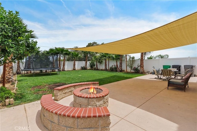 1709 Duncan Way, Corona, CA 92881 - view of patio featuring a trampoline, an outdoor fire pit, and outdoor dining space