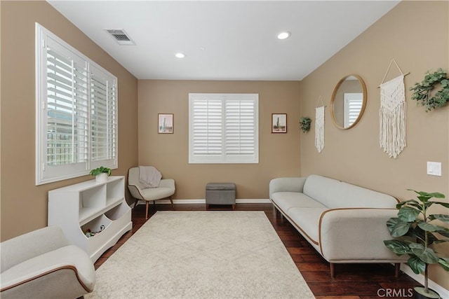 1709 Duncan Way, Corona, CA 92881 - living area featuring dark wood finished floors, healthy amount of natural light, recessed lighting, and baseboards