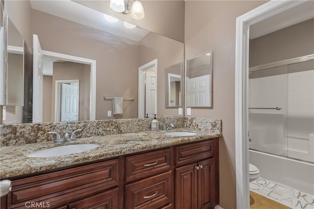 1709 Duncan Way, Corona, CA 92881 - bathroom featuring toilet, double vanity, shower / bath combination with glass door, and tile patterned flooring