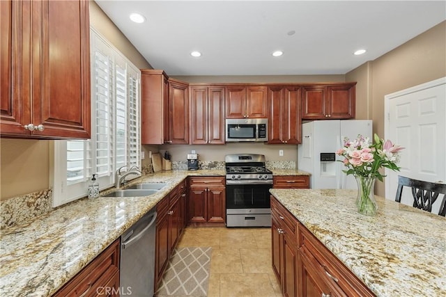 1709 Duncan Way, Corona, CA 92881 - kitchen featuring stainless steel appliances, a sink, light stone countertops, recessed lighting, and light tile patterned floors