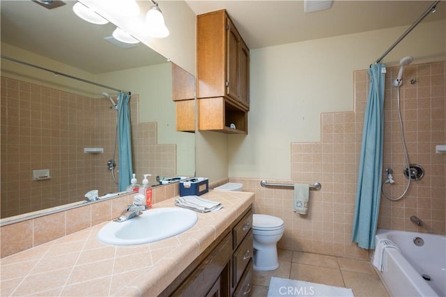 3876 Orcutt Rd, San Luis Obispo, CA 93401 - full bathroom with tile walls, tile patterned floors, shower / tub combo with curtain, toilet, and vanity