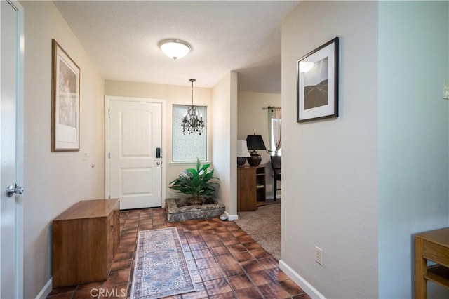 3876 Orcutt Rd, San Luis Obispo, CA 93401 - foyer featuring a chandelier and baseboards