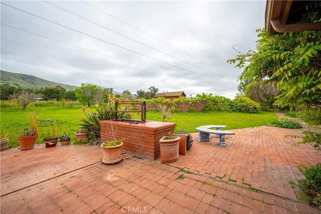 3876 Orcutt Rd, San Luis Obispo, CA 93401 - view of patio / terrace with an outdoor fire pit and a mountain view