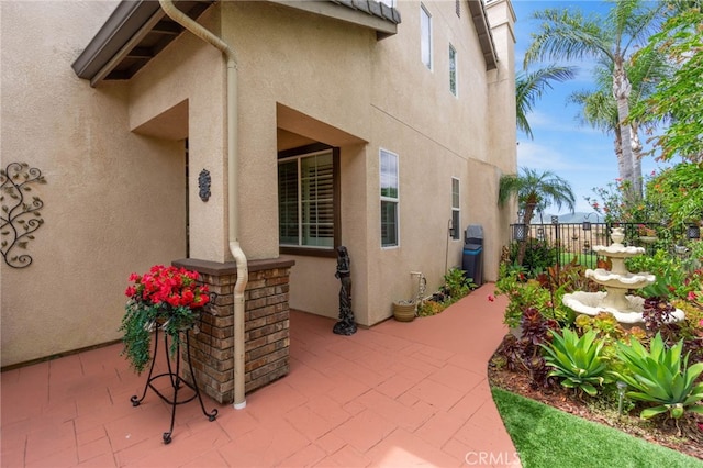 27781 Country Lane Rd, Laguna Niguel, CA 92677 - property entrance with stucco siding and a patio area