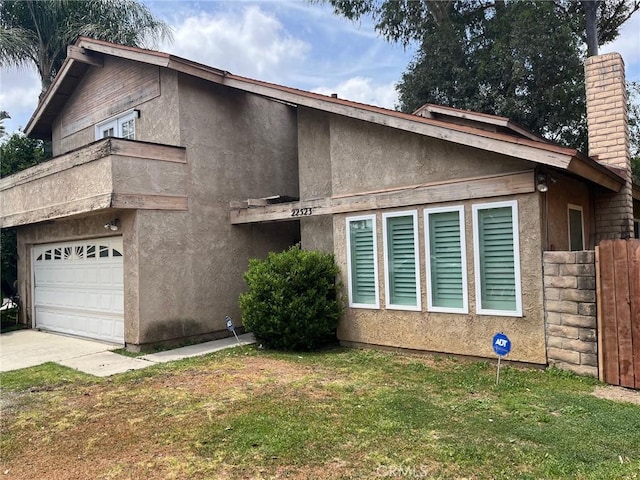22523 Enadia Way, West Hills, CA 91307 - view of side of home featuring a chimney, stucco siding, and concrete driveway