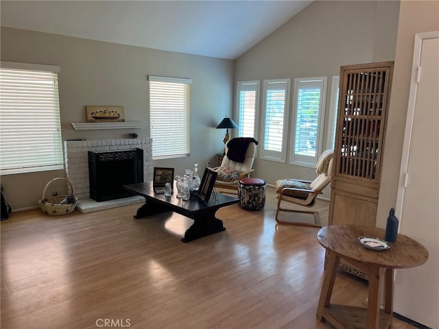 22523 Enadia Way, West Hills, CA 91307 - living room with plenty of natural light, lofted ceiling, wood finished floors, a brick fireplace, and baseboards