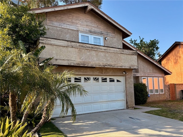 22523 Enadia Way, West Hills, CA 91307 - view of front of house with a garage, concrete driveway, and stucco siding