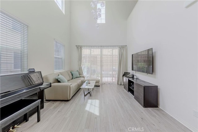 14533 Verona Pl, Eastvale, CA 92880 - living room featuring a towering ceiling and light wood-type flooring