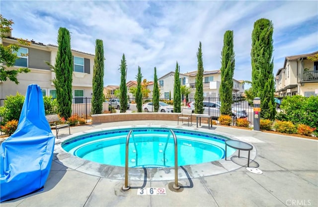 14533 Verona Pl, Eastvale, CA 92880 - view of pool featuring a residential view and fence