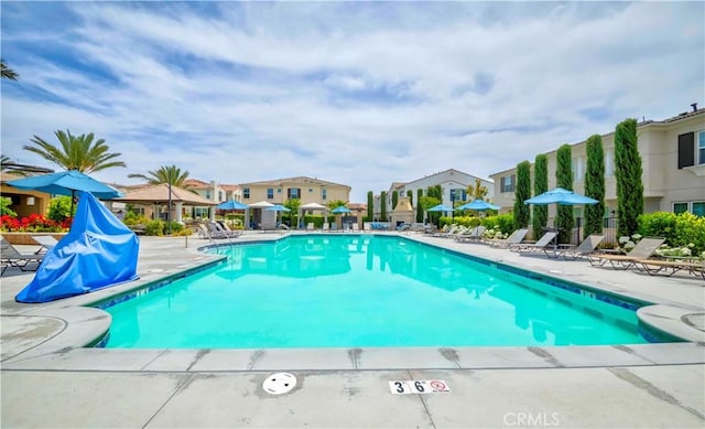 14533 Verona Pl, Eastvale, CA 92880 - community pool with a patio area and a residential view