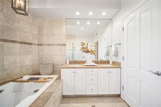 11989 Laurelwood Dr Unit 3, Studio City, CA 91604 - full bath with recessed lighting, a garden tub, double vanity, and tile patterned floors