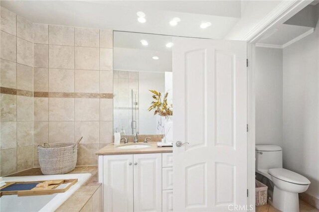11989 Laurelwood Dr Unit 3, Studio City, CA 91604 - bathroom featuring toilet, tiled shower, recessed lighting, and vanity