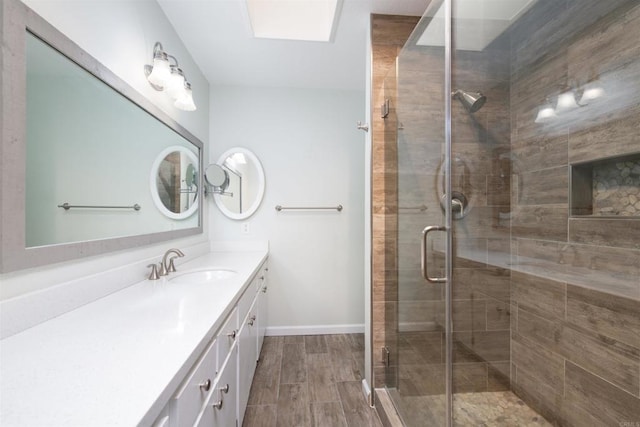 4402 Shearwater Way, Oceanside, CA 92057 - full bath with vanity, a stall shower, a skylight, and baseboards