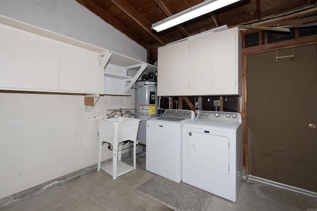 4402 Shearwater Way, Oceanside, CA 92057 - laundry area with washer and dryer, cabinet space, and water heater