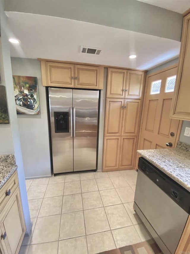 34354 Laura Way, Rancho Mirage, CA 92270 - kitchen featuring appliances with stainless steel finishes, light stone counters, light tile patterned floors, and recessed lighting
