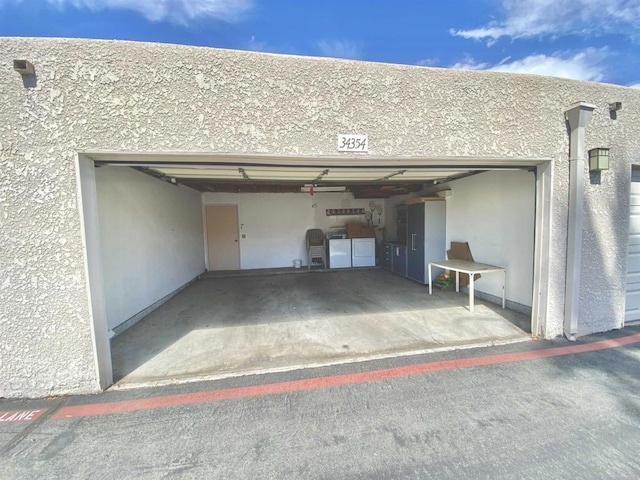 34354 Laura Way, Rancho Mirage, CA 92270 - garage with washing machine and clothes dryer