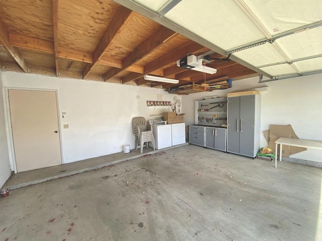 34354 Laura Way, Rancho Mirage, CA 92270 - garage featuring washer and dryer and a garage door opener