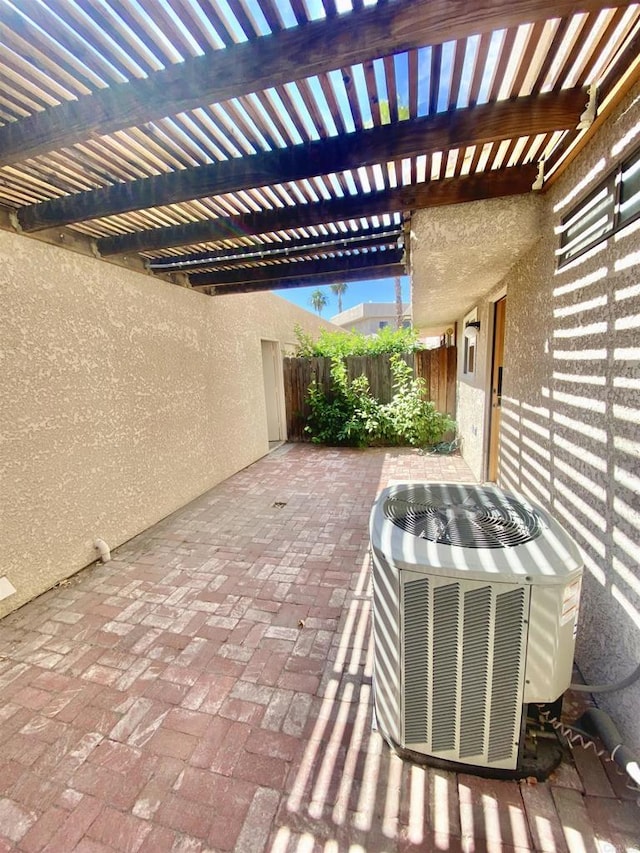 34354 Laura Way, Rancho Mirage, CA 92270 - view of patio / terrace featuring cooling unit, fence, and a pergola