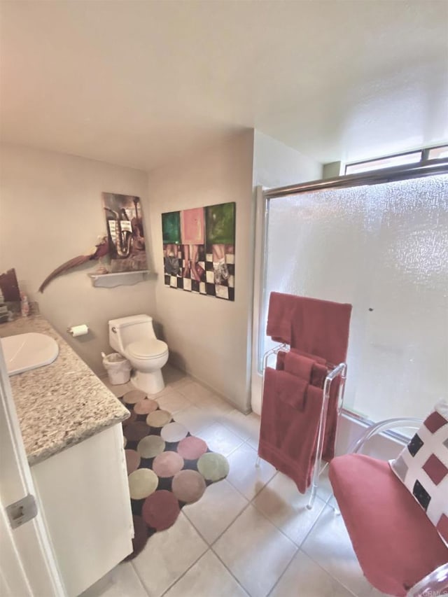 34354 Laura Way, Rancho Mirage, CA 92270 - bathroom featuring a shower stall, tile patterned flooring, vanity, and toilet
